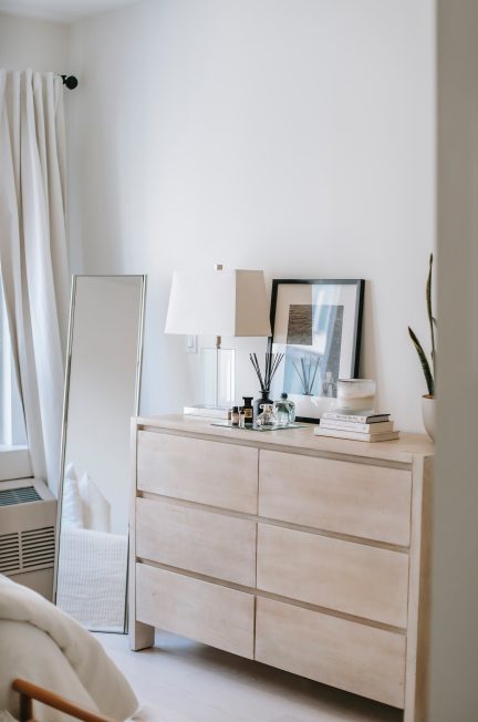 bedroom interior with chest of drawers and mirror