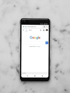 black android smartphone showing google site