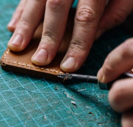 Tools - Person Holding Brown Leather Material