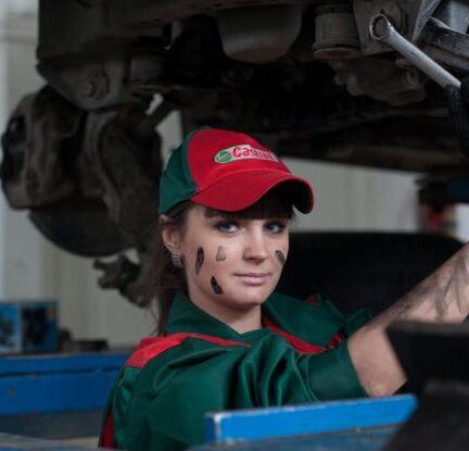 Car Manufacturing - Woman Holding Gray Steel Wrench