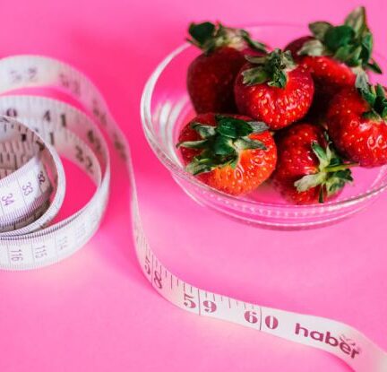 Health And Fitness - Strawberries And Measuring Tape