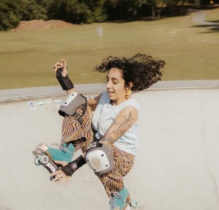 Outdoor Activities - Woman in Roller Skates Jumping