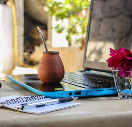 Digital Nomad - White Notebook Beside Blue Laptop Computer