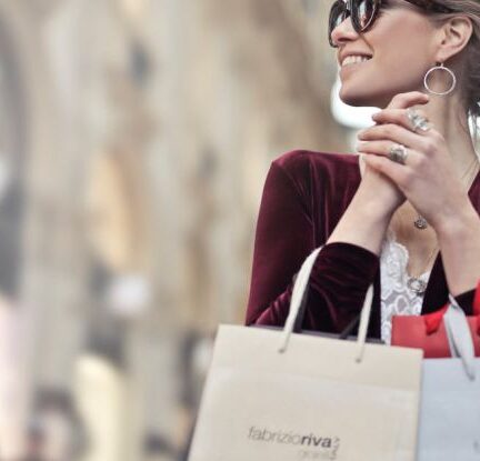 Fashion Brand - Photo of a Woman Holding Shopping Bags