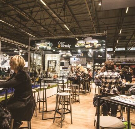 Business Networking - People Inside a Cafe With Tables and Chairs