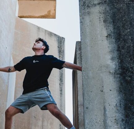 Scaling - Man Climbing a Building