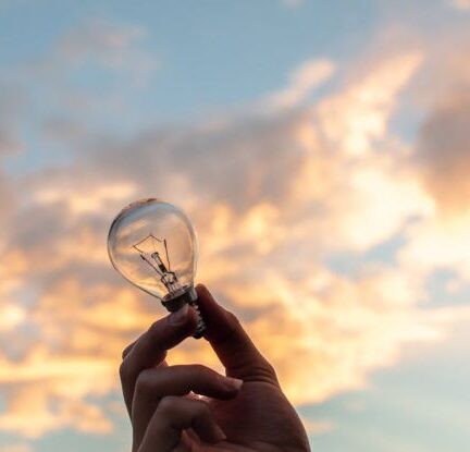 Innovation - Person Holding Clear Light Bulb