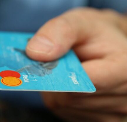 Debt Consolidation - Person Holding Debit Card