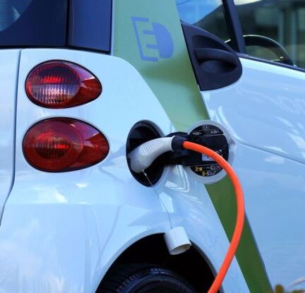 Electric Vehicles - White and Orange Gasoline Nozzle